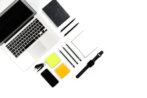 Working table top view, flat lay. Business items on a white table, laptop, cl Stock Photos