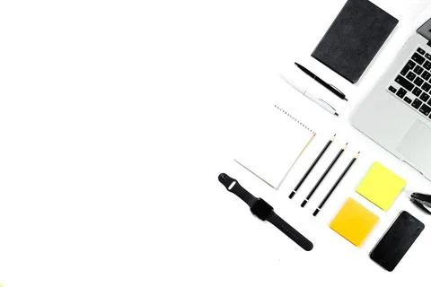 Working table top view, flat lay. Business items on a white table, laptop, cl Stock Photos