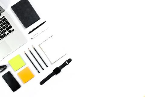 Working table top view, flat lay. Business items on a white table, laptop, cl Stock Photos