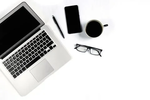 Working table top view, flat lay. Business items on a white table, laptop, cl Stock Photos