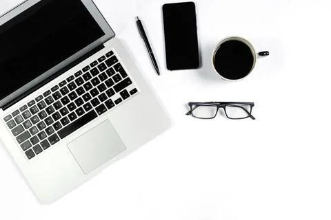 Working table top view, flat lay. Business items on a white table, laptop, cl Stock Photos