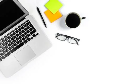 Working table top view, flat lay. Business items on a white table, laptop, cl Stock Photos