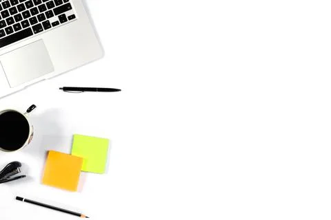 Working table top view, flat lay. Business items on a white table, laptop, ph Stock Photos