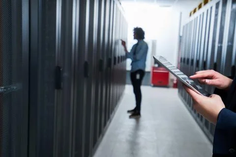 Working on tablet. server room Stock Photos