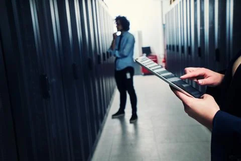 Working on tablet. server room Stock Photos
