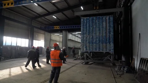  The working team moves a large container on a crane. Stock Footage 105228320