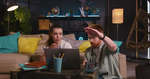 Working as a team. Two happy young Caucasian student friends working together Video stock 171406919
