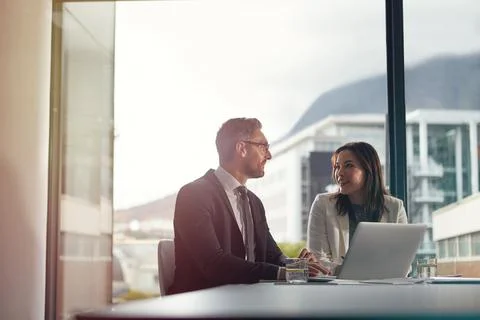 Working through their business process. two office businesspeople having an Foto stock