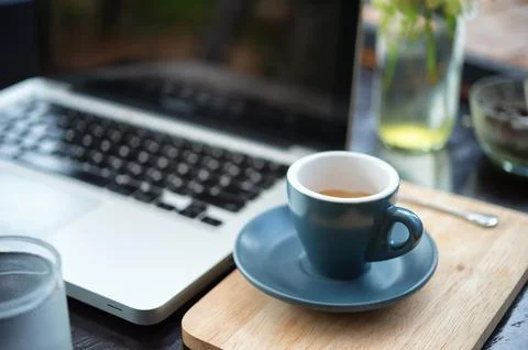 Working time. hot coffee, espesso with laptop on wood teble. business concept Stock Photos