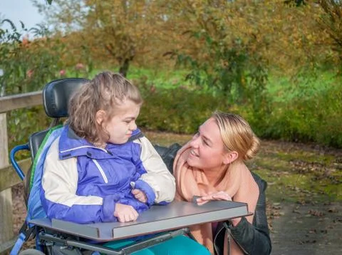 Working together with disability Stock Photos