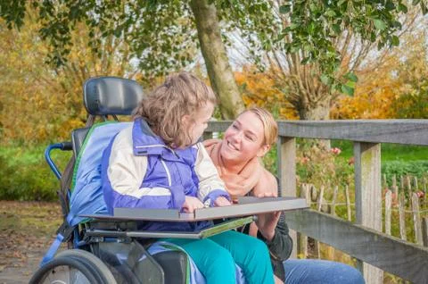 Working together with disability Stock Photos