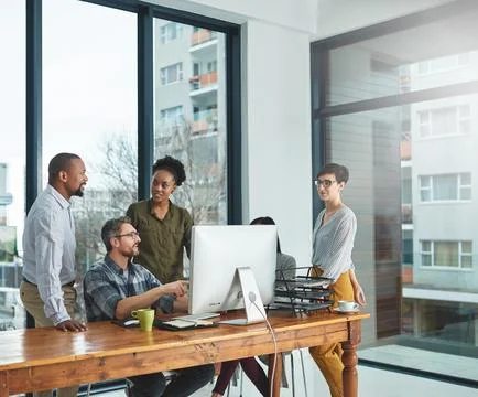 Working together to get the task done. Shot of businesspeople working together Stock Photos