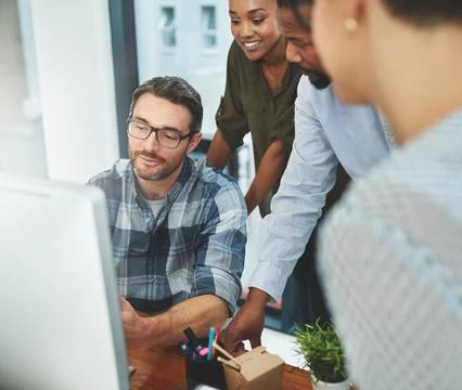 Working together to get the task done. Shot of businesspeople working together Stock Photos