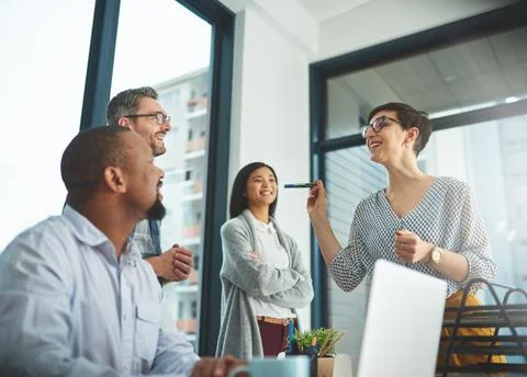 Working together to get the task done. Shot of businesspeople working together Stock Photos