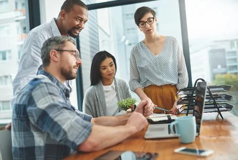Working together to get the task done. Shot of businesspeople working together Stock Photos