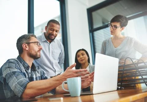 Working together to get the task done. Shot of businesspeople working together Stock Photos