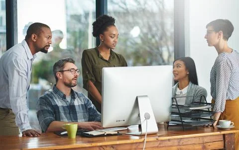 Working together to get the task done. Shot of businesspeople working together Stock Photos