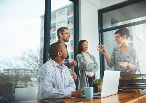 Working together to get the task done. Shot of businesspeople working together Stock Photos