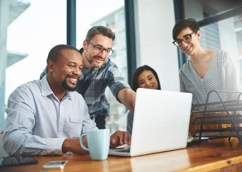 Working together to get the task done. Shot of businesspeople working together Stock Photos
