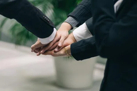 Working together or team work concept.Group of unidentified young business pe Stock Photos