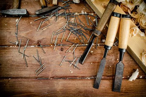 Working tool. Chisel, hammer and nails. Stock Photos