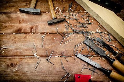 Working tool. Chisel, hammer and nails. Stock Photos