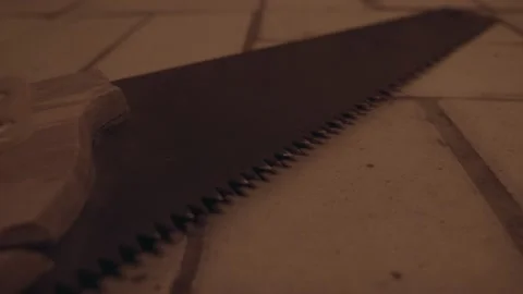 Working tool for torture in an abandoned house. Tsaw is lying on the floor Stock Footage 238661659