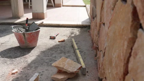 Working tools and instruments scattered on the ground on construction site Stock Footage 162763885