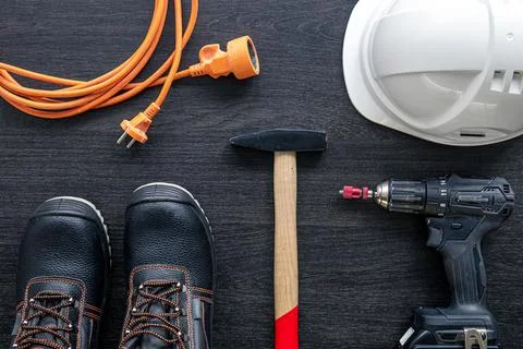 Working tools and things of a worker, builder or electrician, top view. Stock Photos