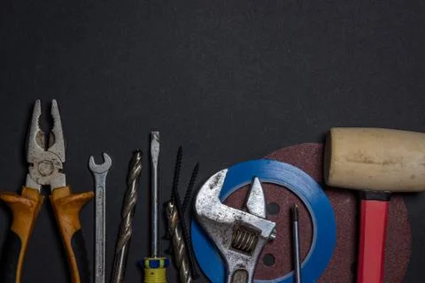 Working tools on a black background. Stock Photos