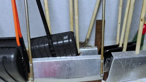 Working tools for cleaning snow in a snowfall. Shovels. Stock Footage 276670423