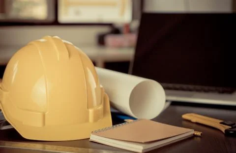 Working tools Engineer office desk with helmet Stock Photos