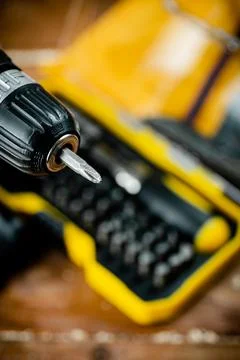 Working tools. Screwdriver bits. On a wooden background. Stock Photos
