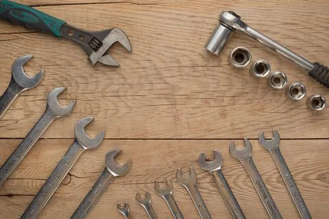 Working tools on a wooden rustic background. Top view with an empty place for Stock Photos