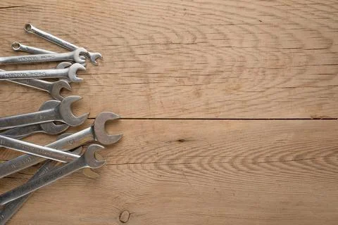 Working tools on a wooden rustic background. Top view with an empty place for Stock Photos