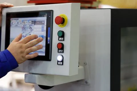 Working with touchscreen control panel Stock Photos