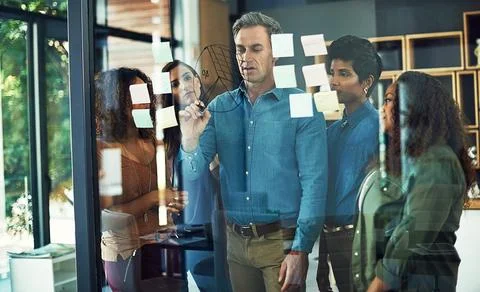 Working towards developing their strengths and skills as a team. a group of Stock Photos