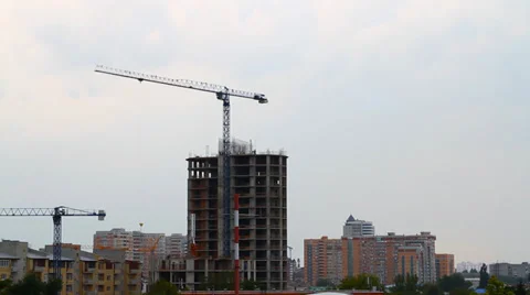 Working tower crane at a construction site Stock Footage 32845242