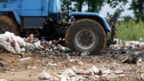 Working tractor at dump Stock Footage 78478664
