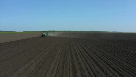 Working on a tractor in the field Stock Footage 159122028