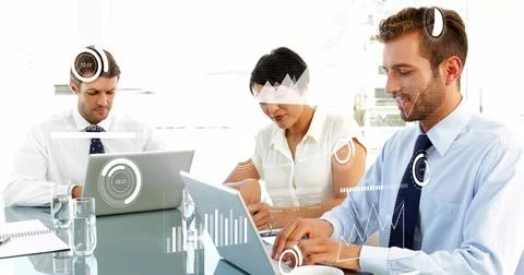 Working trio analyzing data in boardroom in formal attire using laptops tablet Foto stock