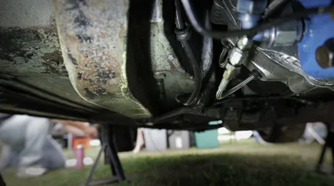 Working under car chassis Stock Footage 32077343