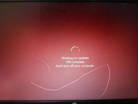 Working on updates before restarting computer. Stock Photos