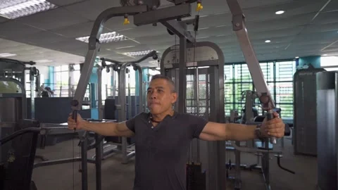 Working on Upper Arms in Gym in Slow-Mo Stock Footage 157672263