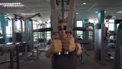 Working on Upper Arms in the Gym in Slow-Mo Stock Footage 157672545
