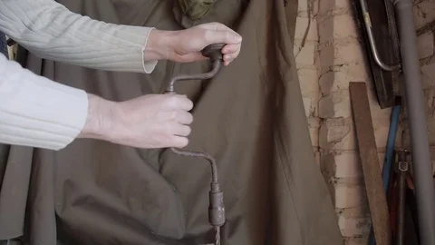 Working with vintage hand drill 스톡 동영상 74064568