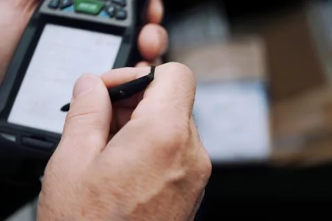 Working In Warehouse With Mobile Computer 写真素材