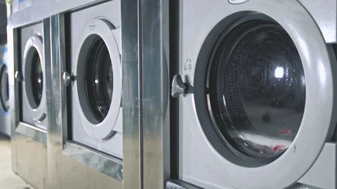 Working washing machines in a laundry Video stock 84105091