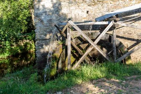 Working watermill wheel Stock Photos