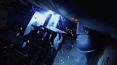 Working welder with equipment Видео 123779816